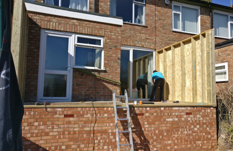 Brick work with timber frame being built