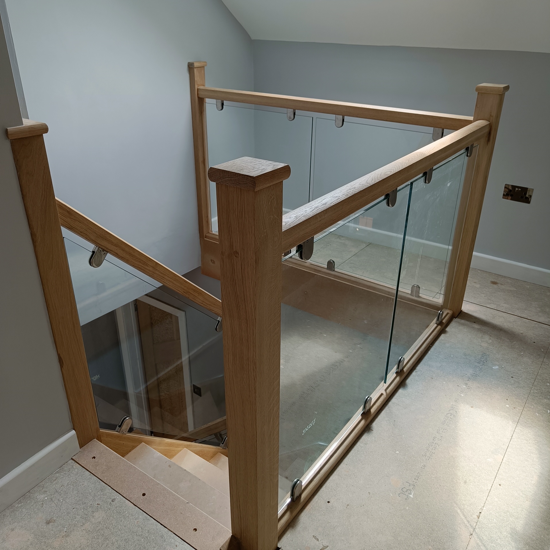 Oak stairs with glass fitted