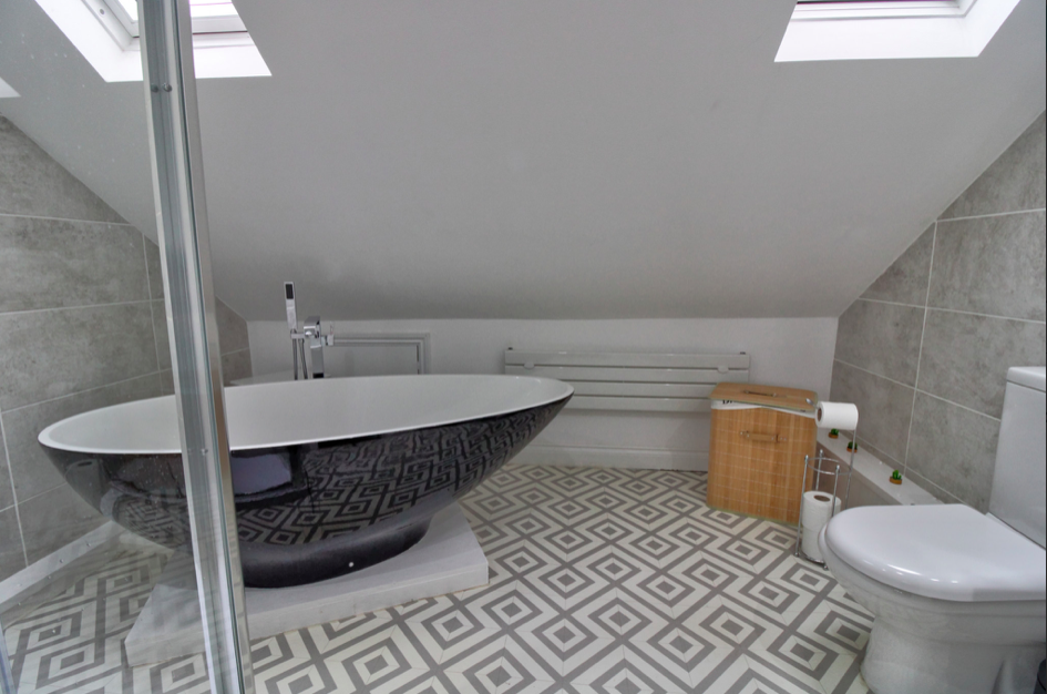 Loft conversion bathroom with velux