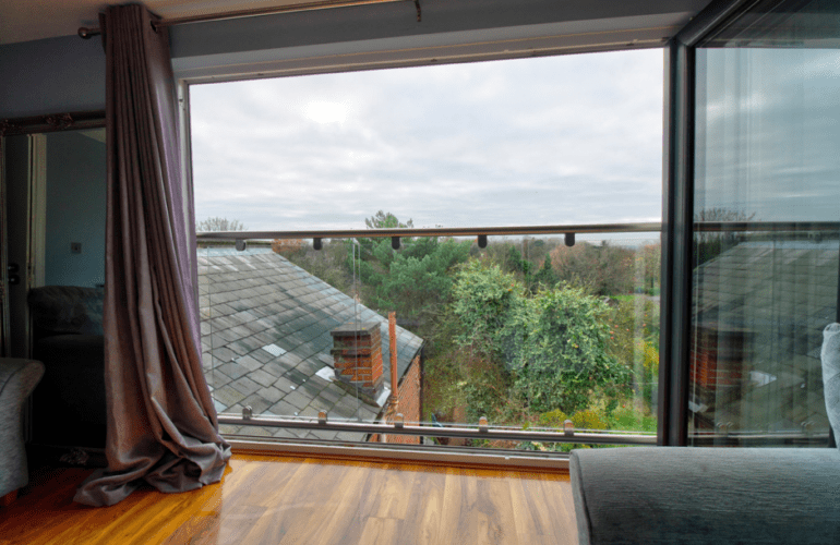 Slide and fold doors with glass balcony