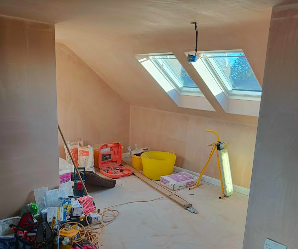 Loft plastered with side by side Keylite windows