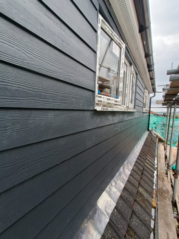 Harry plank being installed to dormer
