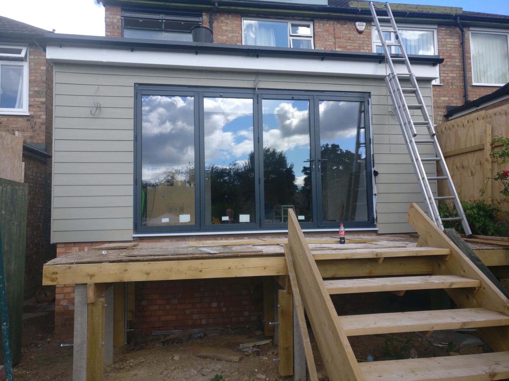 Finished rear extension with bifold doors - Complete loft conversions ...